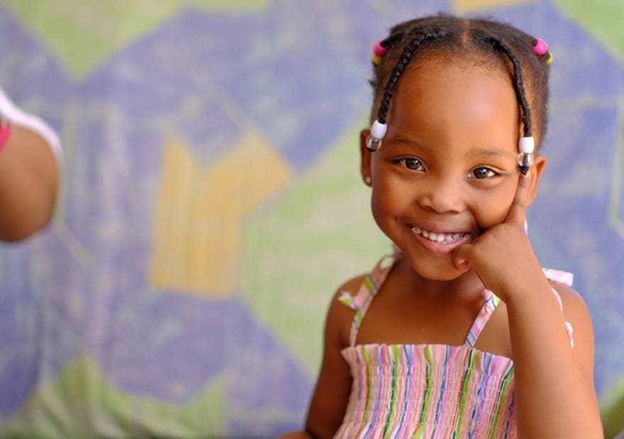 A child with a plaster and a sticker after a jab