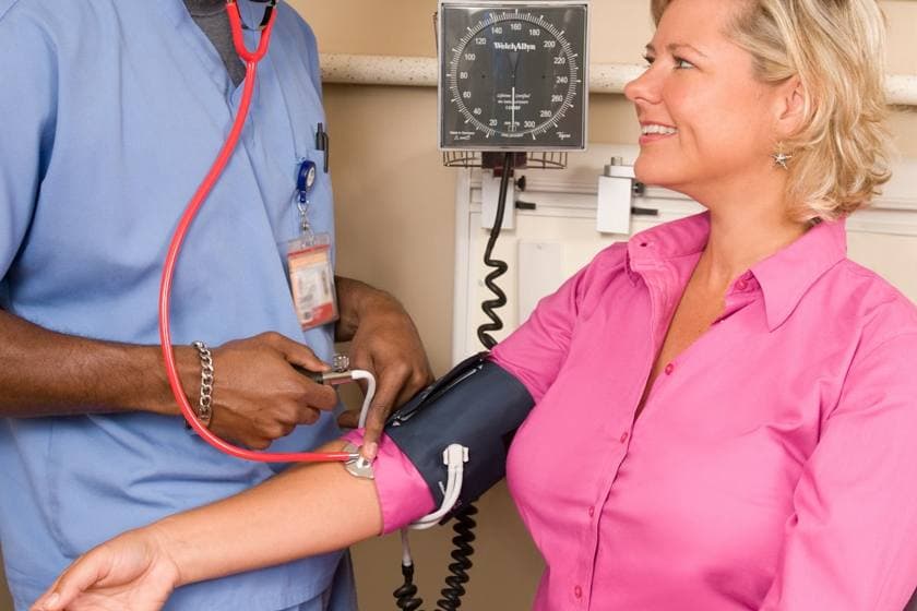 A consultant cardiologist assessing a patient