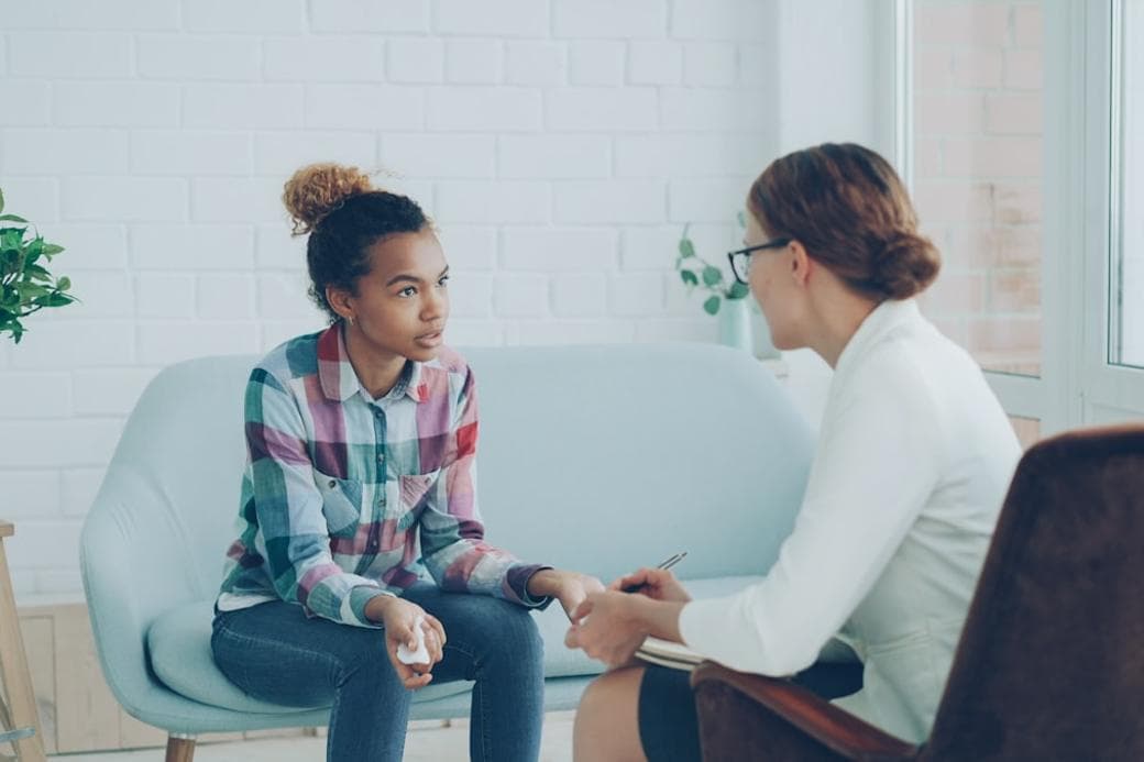 A woman being heard in an unhurried women's health consultation