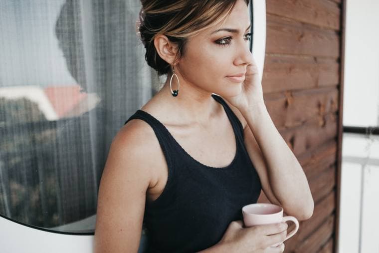 A woman relaxed and at ease at home