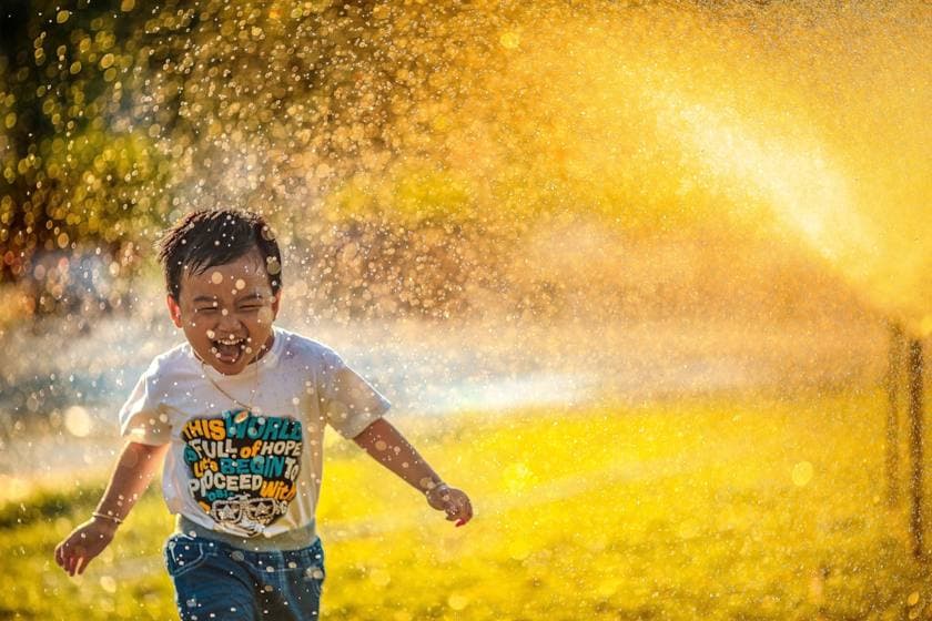 A child running and playing freely outdoors